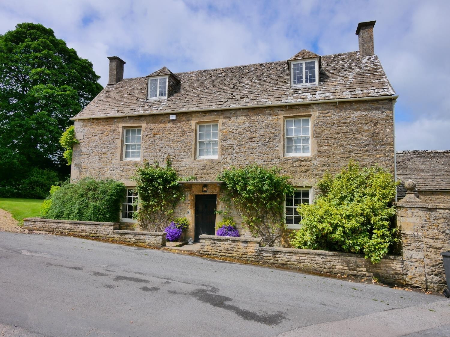 Exterior view of a Cotswold stone cottage
